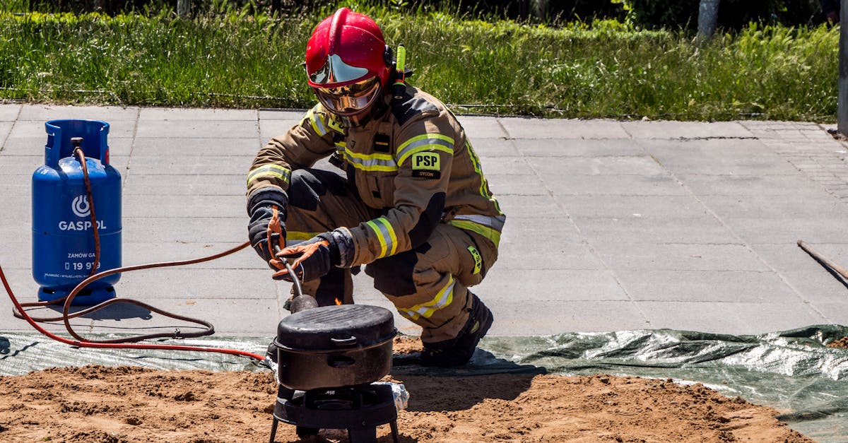 firefighter in action with gas equipment outdoors ensuring safety during a demonstration